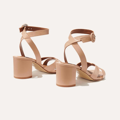 The City Sandal in Rose Nappa, featuring carefully placed straps, and adjustable ankle strap and a comfortable 2.5-inch block heel.
