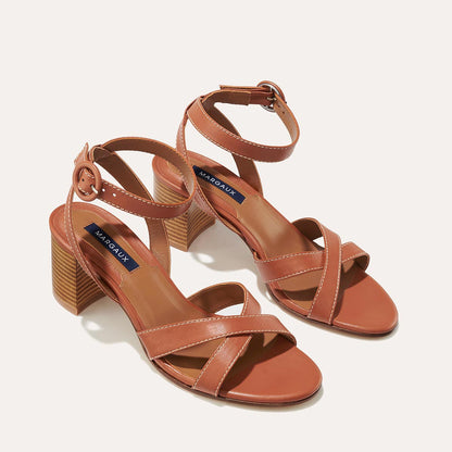 The City Sandal in Saddle Nappa, featuring carefully placed straps, and adjustable ankle strap and a comfortable 2.5-inch block heel.