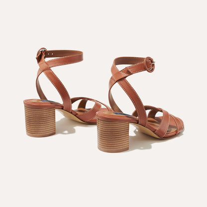The City Sandal in Saddle Nappa, featuring carefully placed straps, and adjustable ankle strap and a comfortable 2.5-inch block heel.