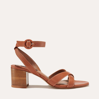 The City Sandal in Saddle Nappa, featuring carefully placed straps, and adjustable ankle strap and a comfortable 2.5-inch block heel.