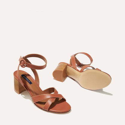 The City Sandal in Saddle Nappa, featuring carefully placed straps, and adjustable ankle strap and a comfortable 2.5-inch block heel.