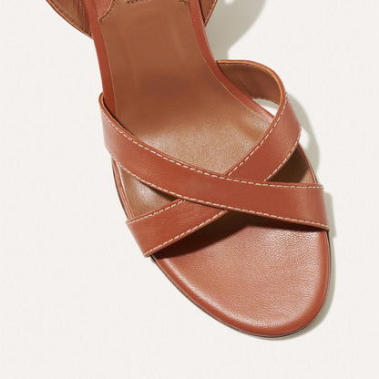 The City Sandal in Saddle Nappa, featuring carefully placed straps, and adjustable ankle strap and a comfortable 2.5-inch block heel.