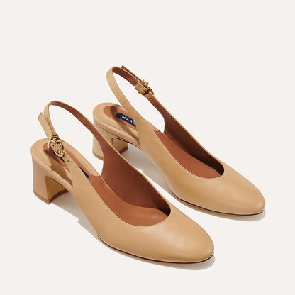 The Cluny Slingback in Dune Nappa, featuring a sleek Italian nappa leather upper with an adjustable buckle and a comfortable 2.5-inch black heel.