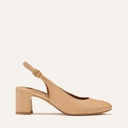 The Cluny Slingback in Dune Nappa, featuring a sleek Italian nappa leather upper with an adjustable buckle and a comfortable 2.5-inch black heel.