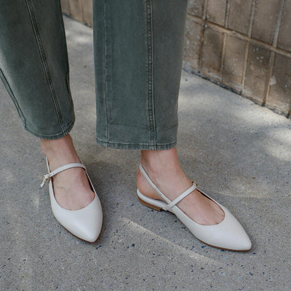The Cluny Slingback in Ecru Nappa, a ballet flat with a pointed toe, a slingback strap and an adjustable strap across the top of the foot for a secure fit.