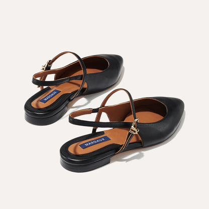 The Cluny Slingback in Black Nappa, a ballet flat with a pointed toe, a slingback strap and an adjustable strap across the top of the foot for a secure fit.