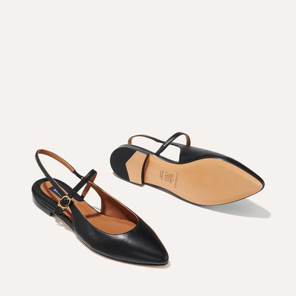 The Cluny Slingback in Black Nappa, a ballet flat with a pointed toe, a slingback strap and an adjustable strap across the top of the foot for a secure fit.