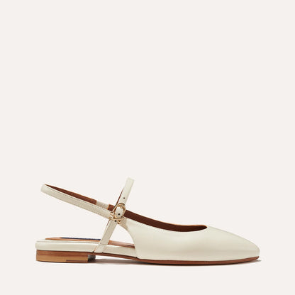 The Cluny Slingback in Ecru Nappa, a ballet flat with a pointed toe, a slingback strap and an adjustable strap across the top of the foot for a secure fit.