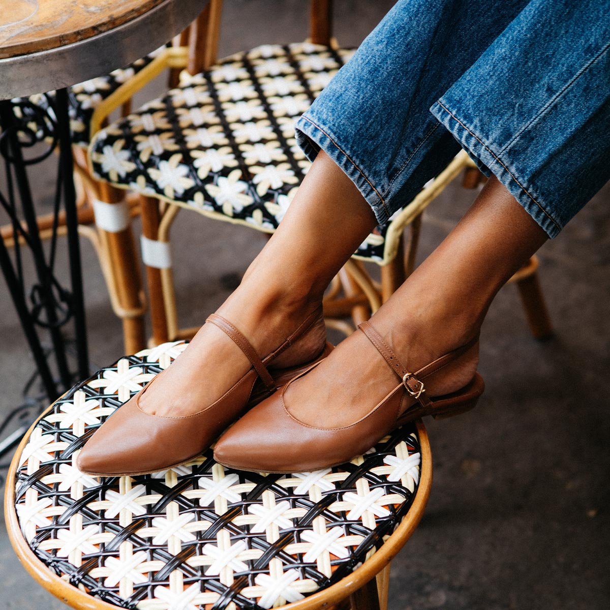 The Cluny Slingback in Saddle Nappa, a ballet flat with a pointed toe, a slingback strap and an adjustable strap across the top of the foot for a secure fit.