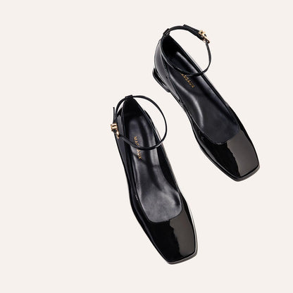 The Daphne in Black Patent, featuring a chic square toe, a supportive ankle strap and a versatile 1-inch block heel,