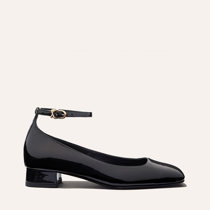 The Daphne in Black Patent, featuring a chic square toe, a supportive ankle strap and a versatile 1-inch block heel,