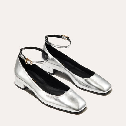 The Daphne in shiny Silver Crinkle Mirror, featuring a chic square toe, a supportive ankle strap and a versatile 1-inch block heel,