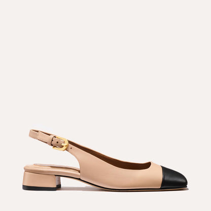 A cap toe low heel slingback neutral and black leather