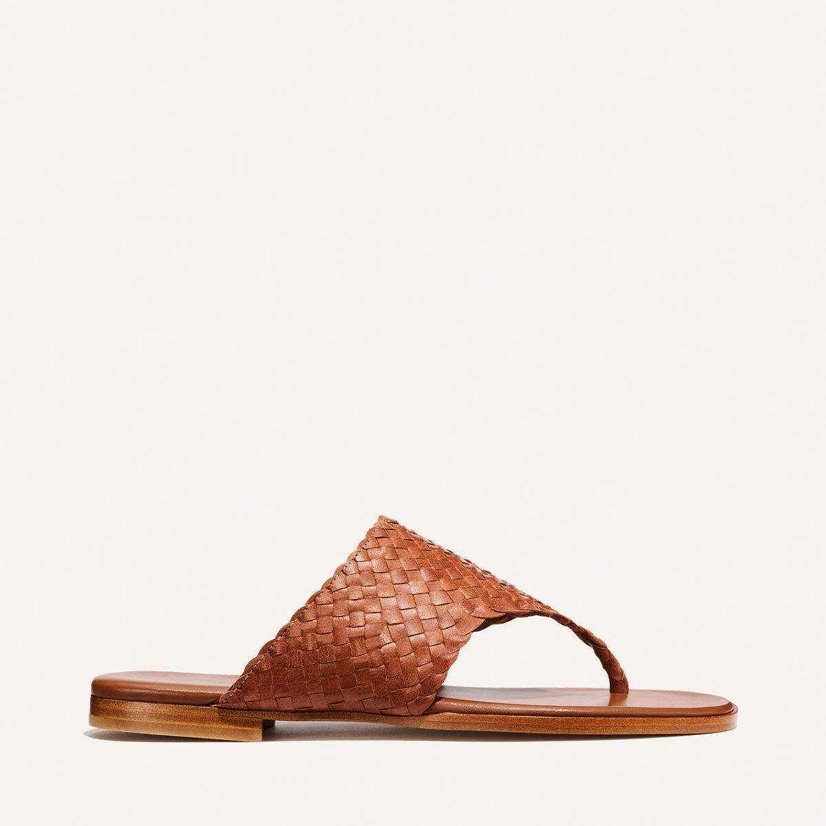 Brown woven sandal on a white background