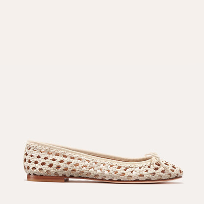 The Demi - Ecru Woven by margaux-development is a handmade woven leather ballet flat in cream and brown, featuring a small bow, rounded toe, and flat brown sole, shown against a light background.