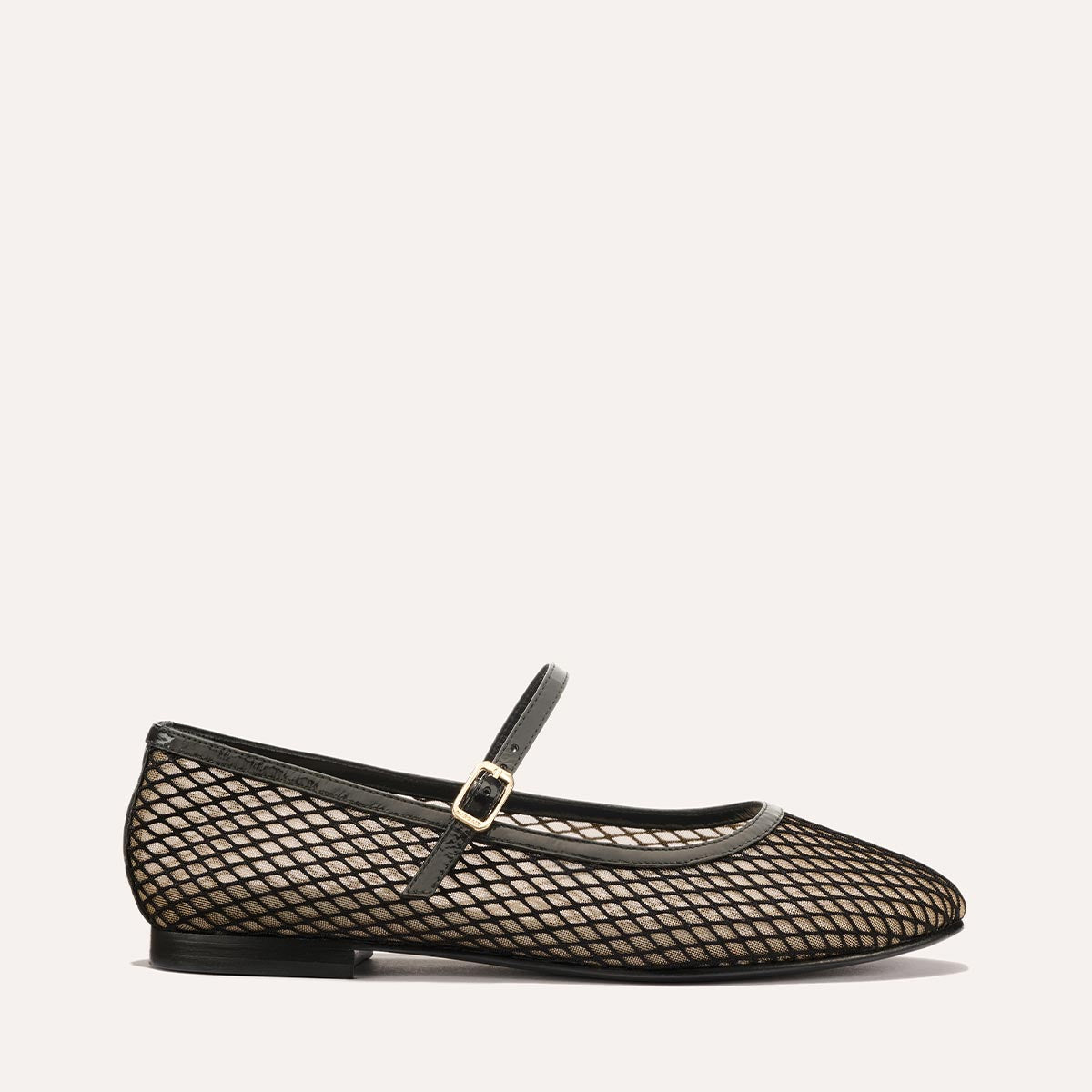 The Demi Jane in Black Fishnet Mesh, a sheer ballet flat with a rounded toe and an adjustable strap for a secure fit.