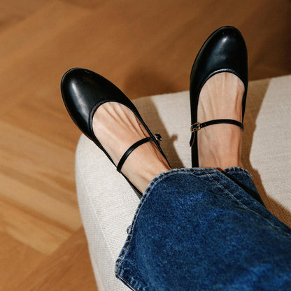 The Demi Jane in Black Nappa, a ballet flat with a rounded toe and an adjustable strap for a secure fit.