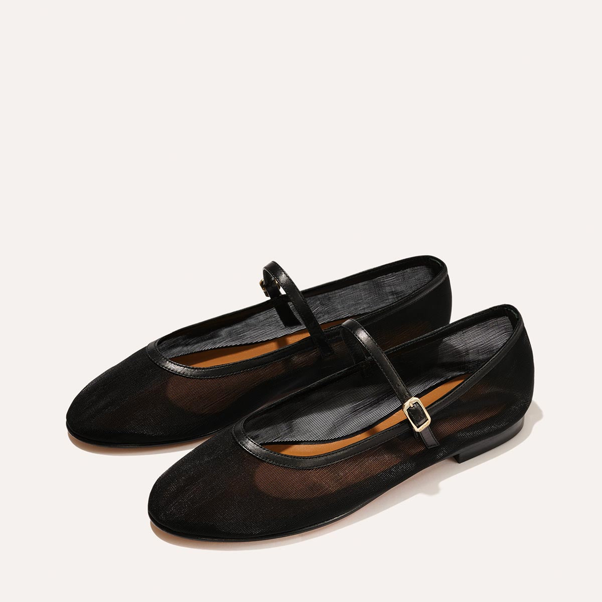 The Demi Jane in Black Mesh, a ballet flat with a rounded toe and an adjustable strap for a secure fit.