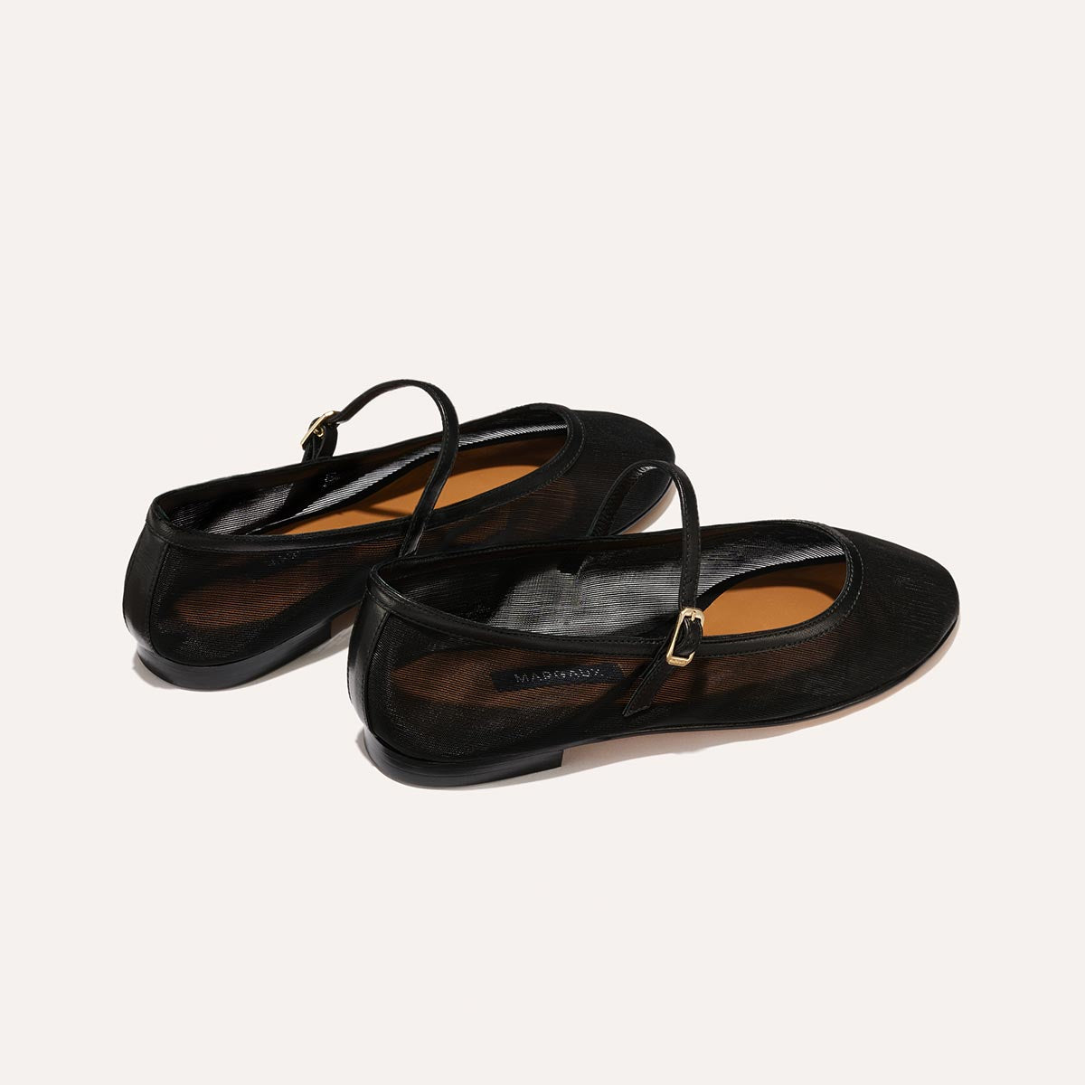 The Demi Jane in Black Mesh, a ballet flat with a rounded toe and an adjustable strap for a secure fit.