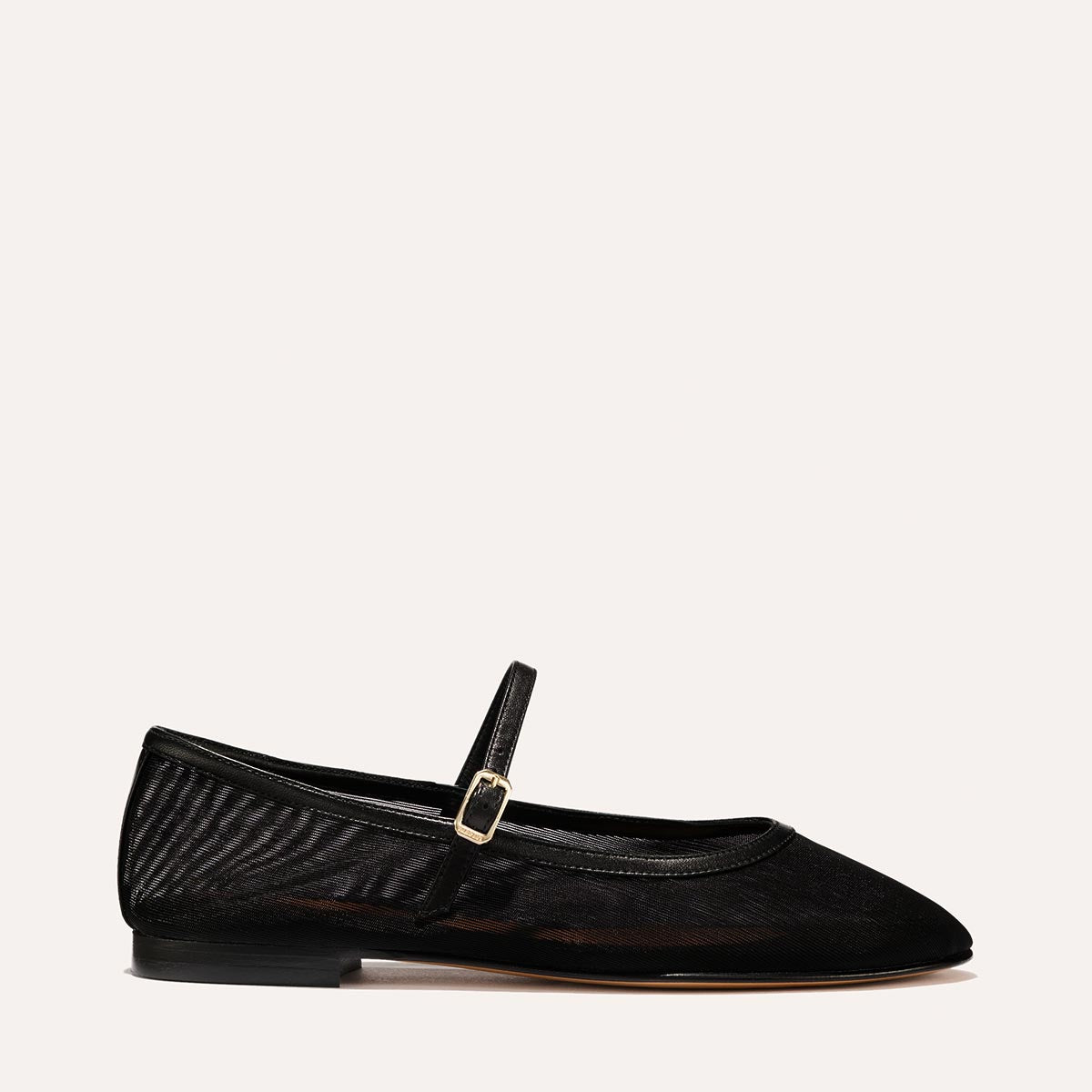 The Demi Jane in Black Mesh, a ballet flat with a rounded toe and an adjustable strap for a secure fit.