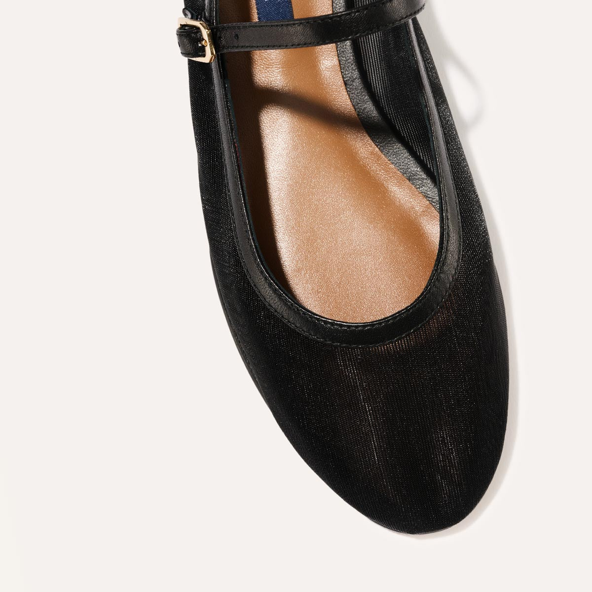 The Demi Jane in Black Mesh, a ballet flat with a rounded toe and an adjustable strap for a secure fit.