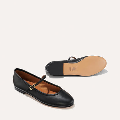 The Demi Jane in Black Nappa, a ballet flat with a rounded toe and an adjustable strap for a secure fit.