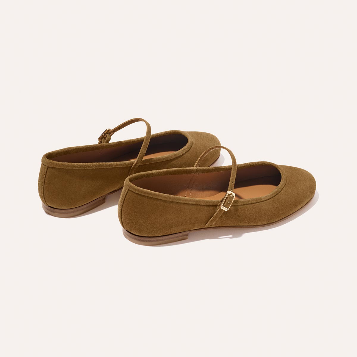 The Demi Jane - Cedar Suede by margaux-development: brown suede Mary Jane flats with a thin strap and buckle, low heel, and rounded toe, shown on a plain white background.