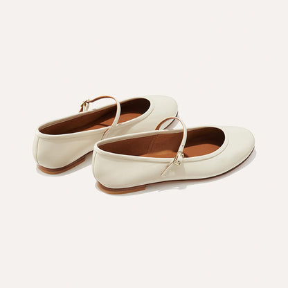 The Demi Jane in Ecru Nappa, a ballet flat with a rounded toe and an adjustable strap for a secure fit.