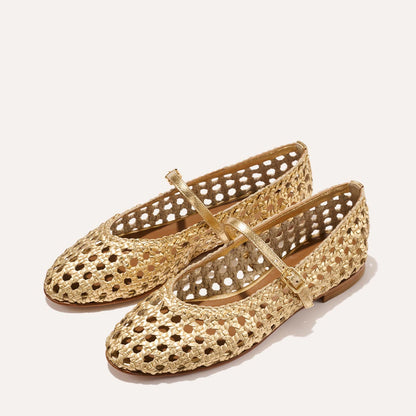 The Demi Jane - Gold Woven Leather by margaux-development: a pair of gold handwoven Mary Jane flats with a strap, buckle, perforated lattice design, cushioned insoles, and brown flat soles, shown on a plain light background.