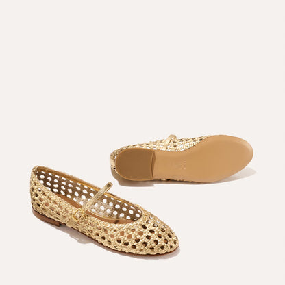 Two gold handwoven leather The Demi Jane Mary Jane flats by margaux-development; one shoe stands upright showing the woven texture and cushioned insole, while the other lies on its side revealing the plain rubber sole.