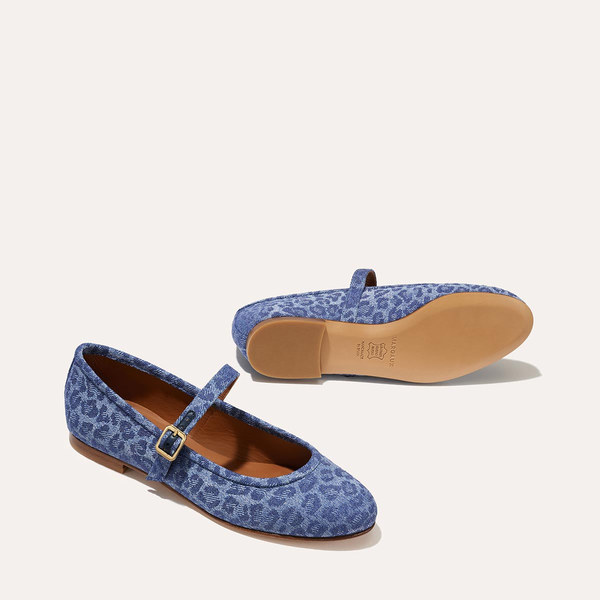 The Demi Jane in blue Leopard Denim, a ballet flat with a rounded toe and an adjustable strap for a secure fit.