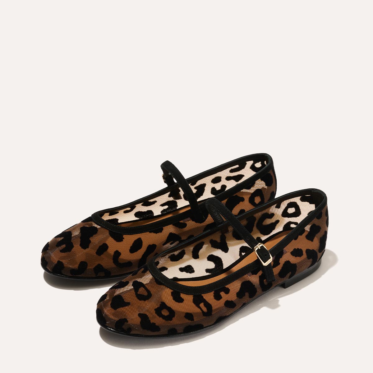 The Demi Jane in Leopard Mesh, a ballet flat with a rounded toe and an adjustable strap for a secure fit.