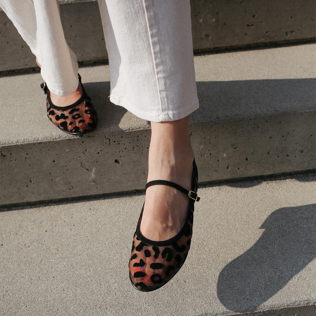 The Demi Jane in Leopard Mesh, a ballet flat with a rounded toe and an adjustable strap for a secure fit.