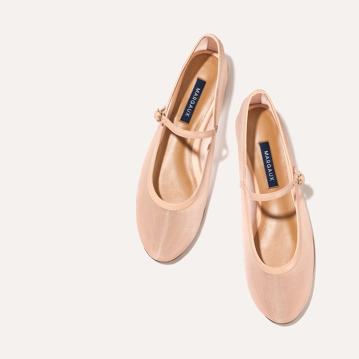 The Demi Jane in Rose Mesh, a ballet flat with a rounded toe and an adjustable strap for a secure fit.