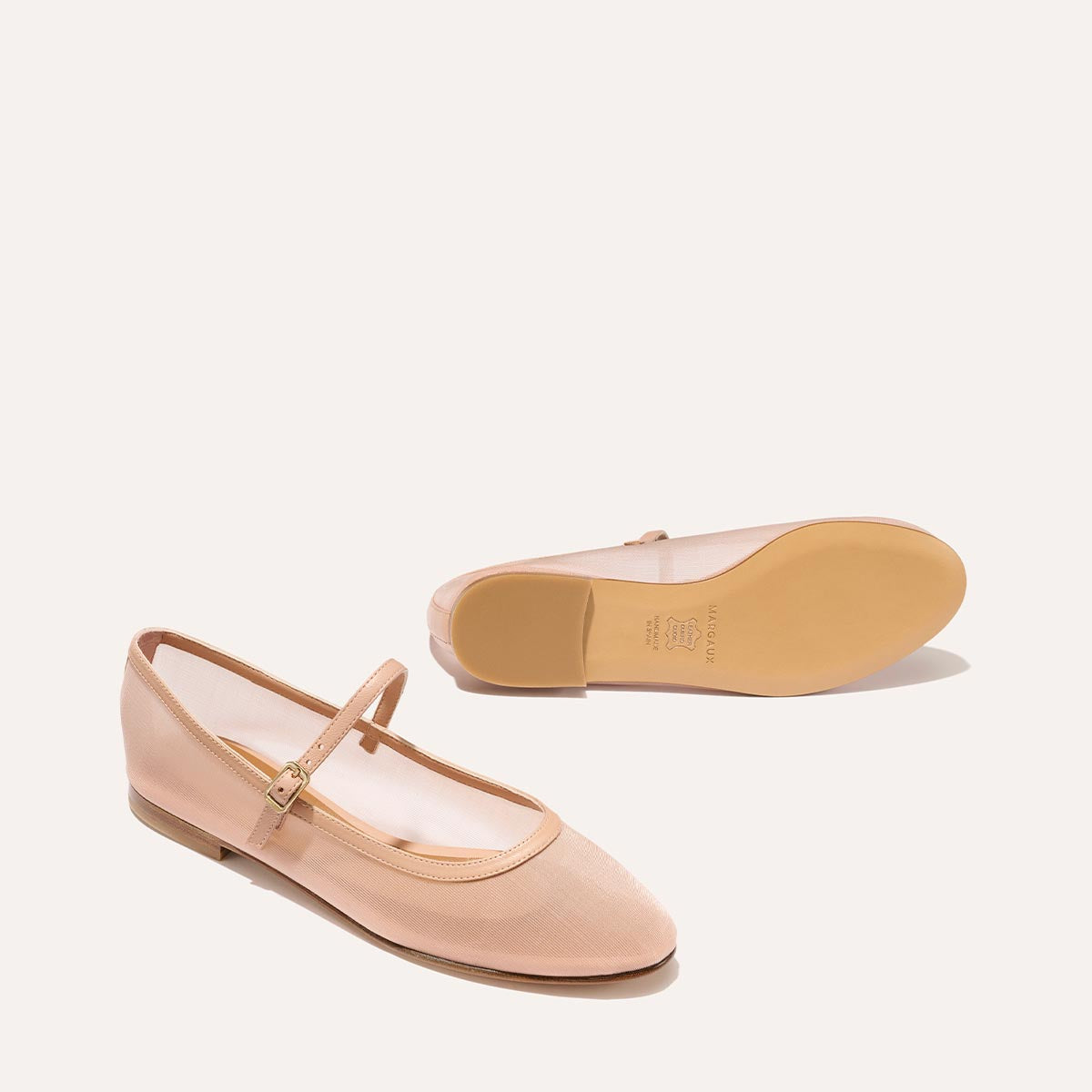 The Demi Jane in Rose Mesh, a ballet flat with a rounded toe and an adjustable strap for a secure fit.