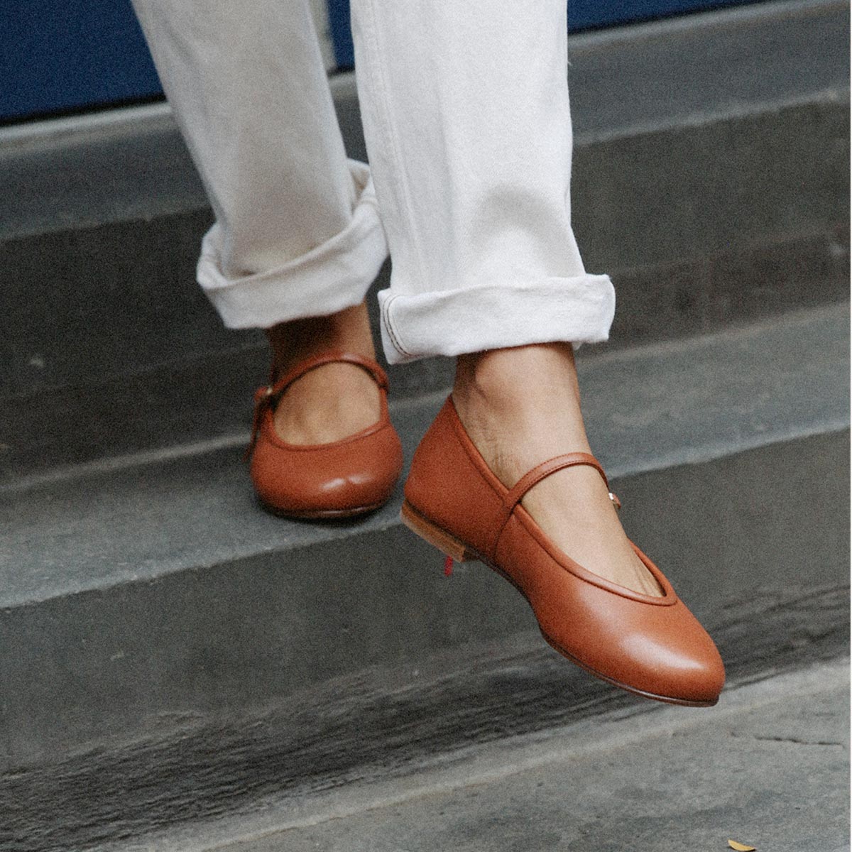 The Demi Jane in buttery soft Saddle Nappa, a ballet flat with a rounded toe and an adjustable strap for a secure fit.