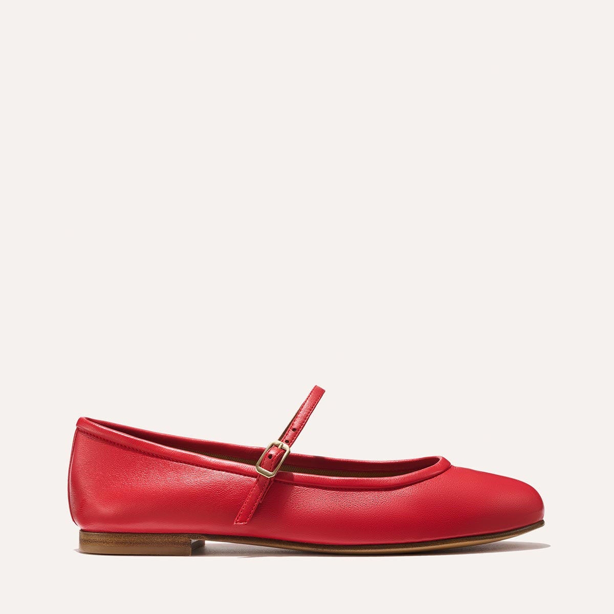 The Demi Jane in buttery soft Scarlet Nappa, a ballet flat with a rounded toe and an adjustable strap for a secure fit.