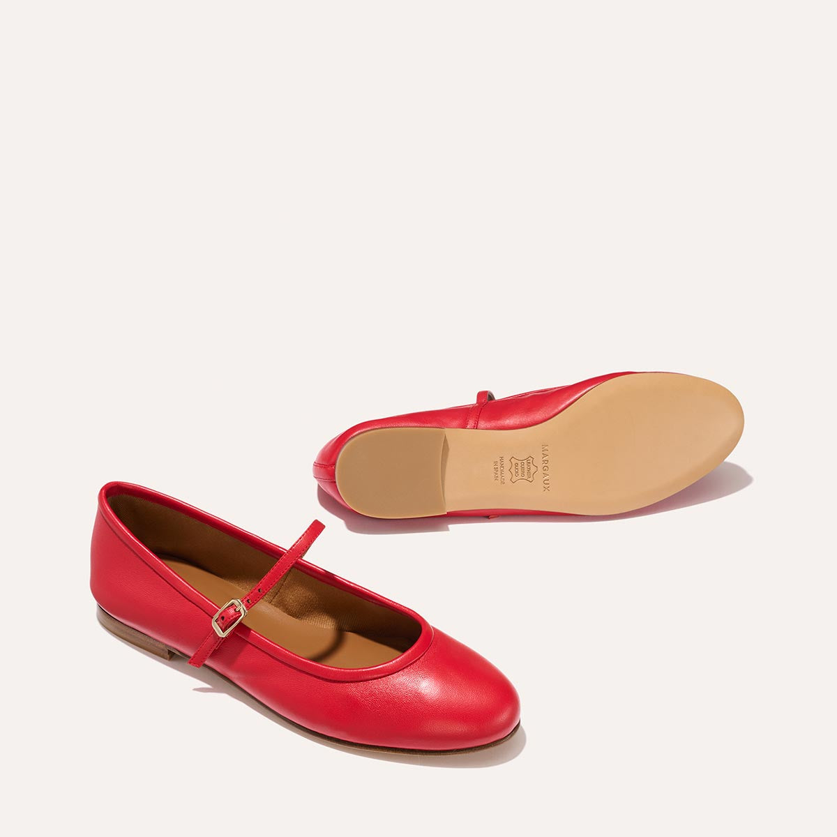 The Demi Jane in buttery soft Scarlet Nappa, a ballet flat with a rounded toe and an adjustable strap for a secure fit.