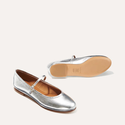 The Demi Jane in metallic Silver Crinkle Mirror, a ballet flat with a rounded toe and an adjustable strap for a secure fit.