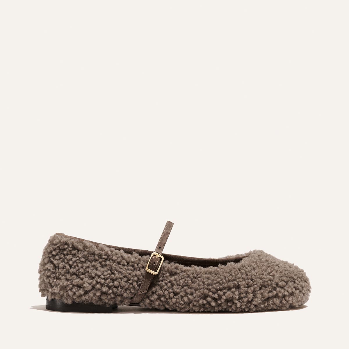 The Demi Jane - Taupe Shearling Mary Jane flat with a thin buckled strap.
