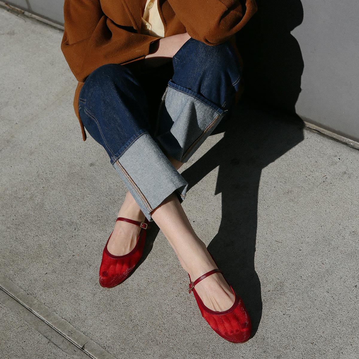 The Demi Jane in Crimson Mesh, a sheer ballet flat with a rounded toe and an adjustable strap for a secure fit.