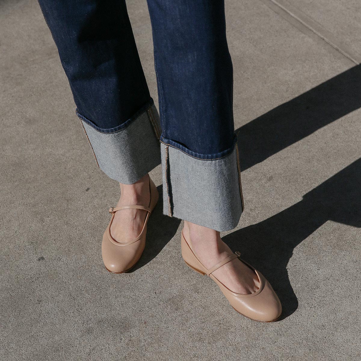 The Demi Jane in buttery soft Dune Nappa, a ballet flat with a rounded toe and an adjustable strap for a secure fit.