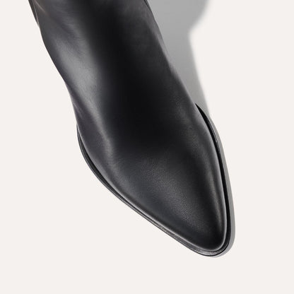 The Downtown Boot in Black Calf, a chic ankle-height design complete with a Western-inspired welt and a comfortable 2.5-inch stacked heel.
