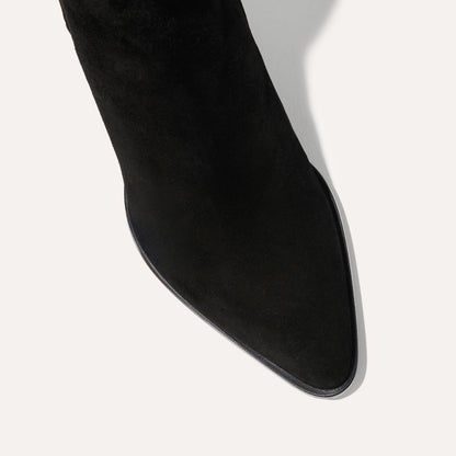 The Downtown Boot in Black Suede, a chic ankle-height design complete with a Western-inspired welt and a comfortable 2.5-inch stacked heel.