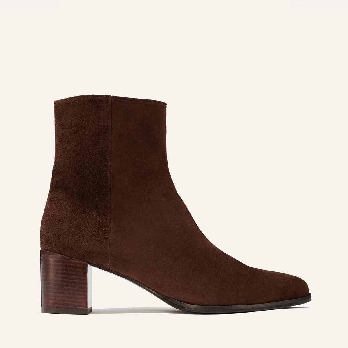 The Downtown Boot in Chocolate Suede, a chic ankle-height design complete with a Western-inspired welt and a comfortable 2.5-inch stacked heel.