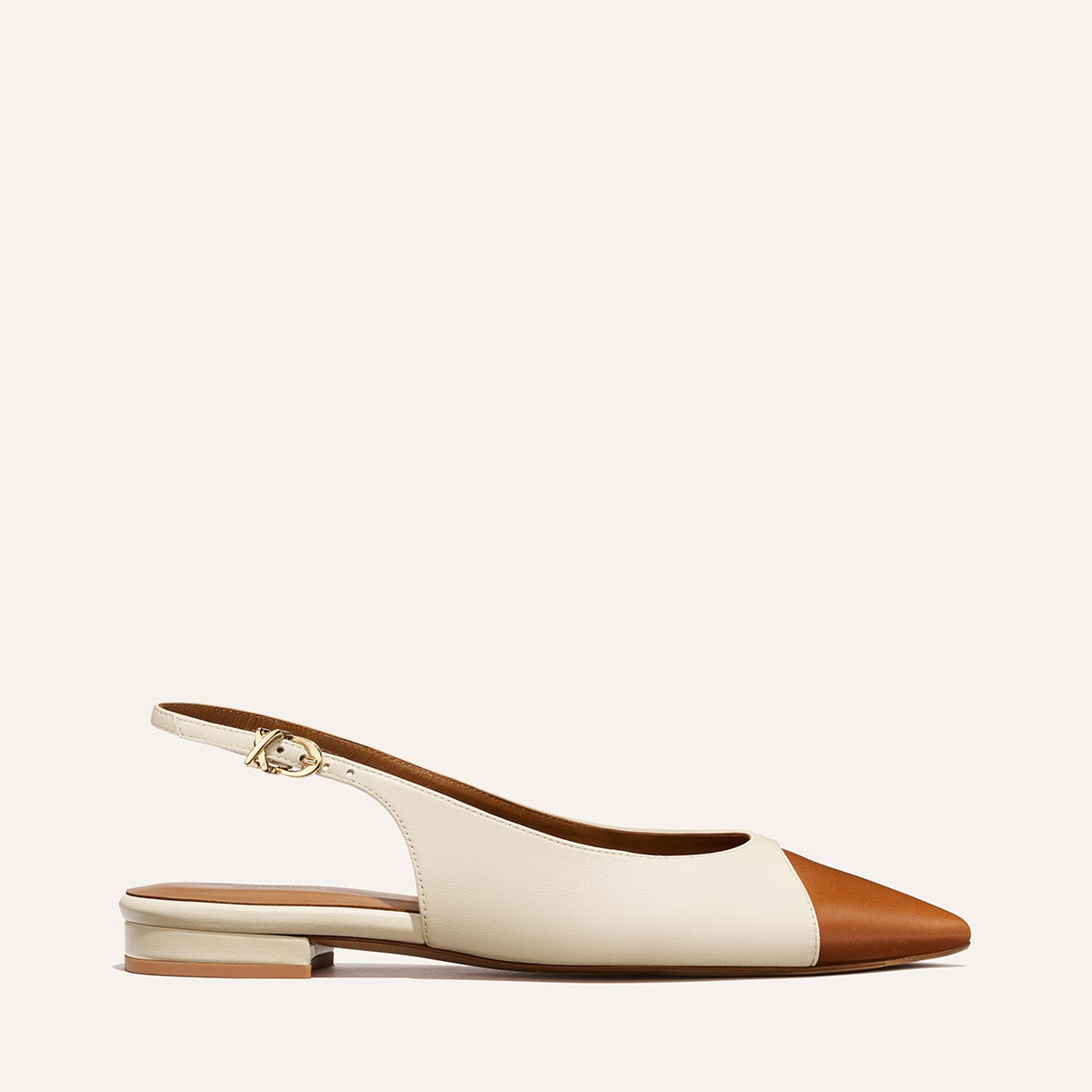 The Elise by margaux-development: a cream and brown Cotton and Saddle Nappa slingback flat with a gold buckle and low heel, displayed on a plain light background.
