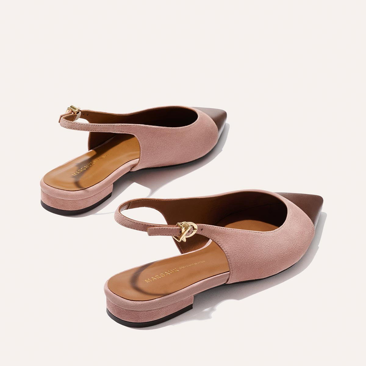 The Elise by margaux-development: women's cap toe slingback flats in dusty rose suede with chocolate nappa pointed toe caps, low block heels, leather soles, and gold buckle straps, displayed on a light background.