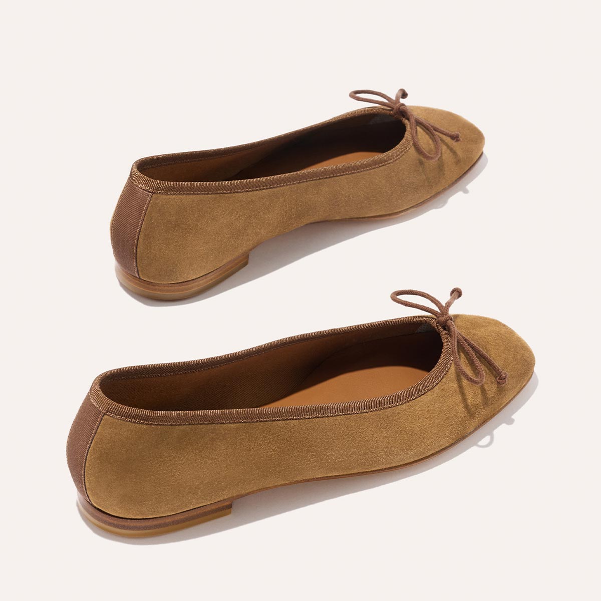 The Fonteyn - Cedar Suede comfort-first tan suede ballet flats featuring a chic ribbon trim and a small bow at the toe.