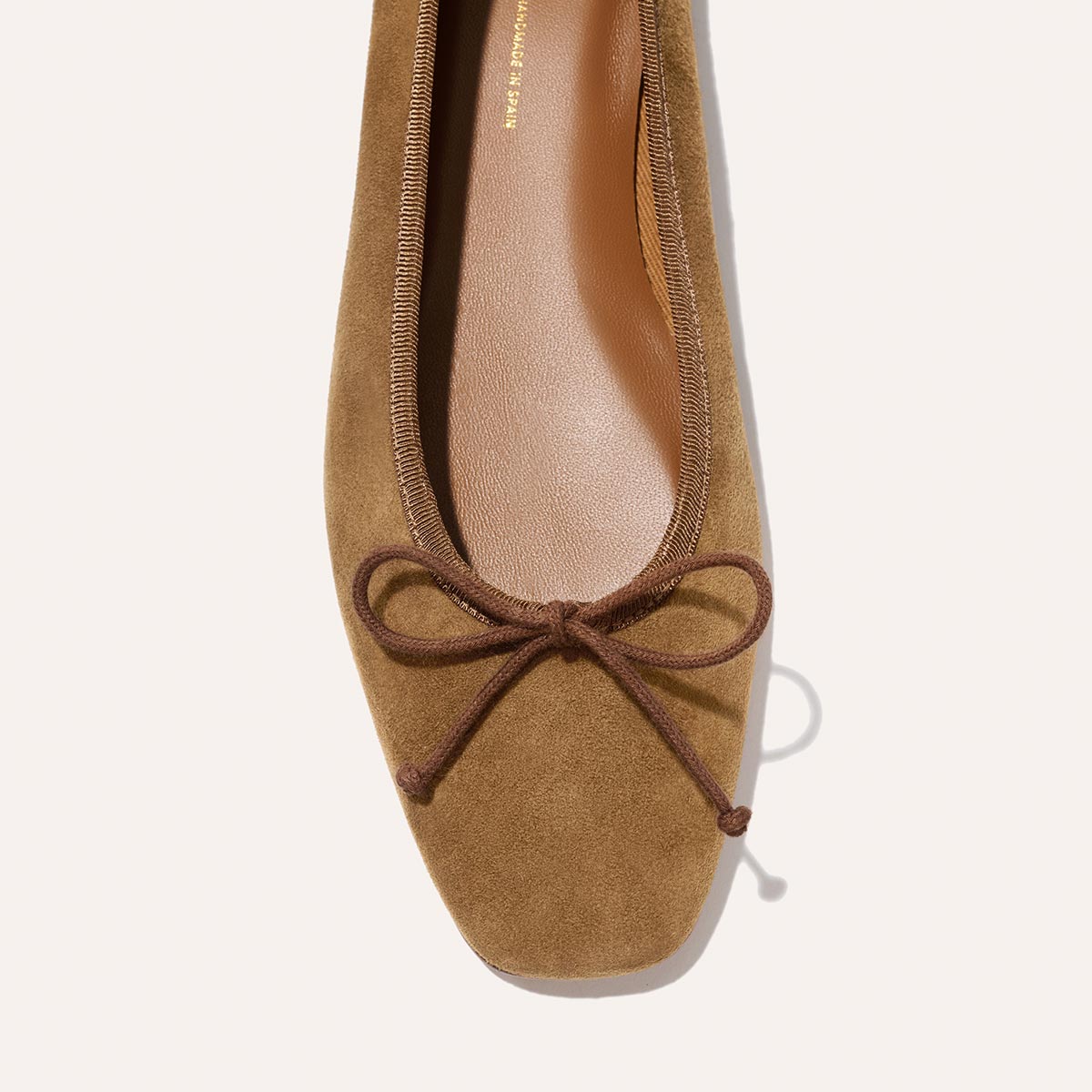Chic brown suede The Fonteyn - Cedar Suede ballet flat with a square toe and a small decorative bow.