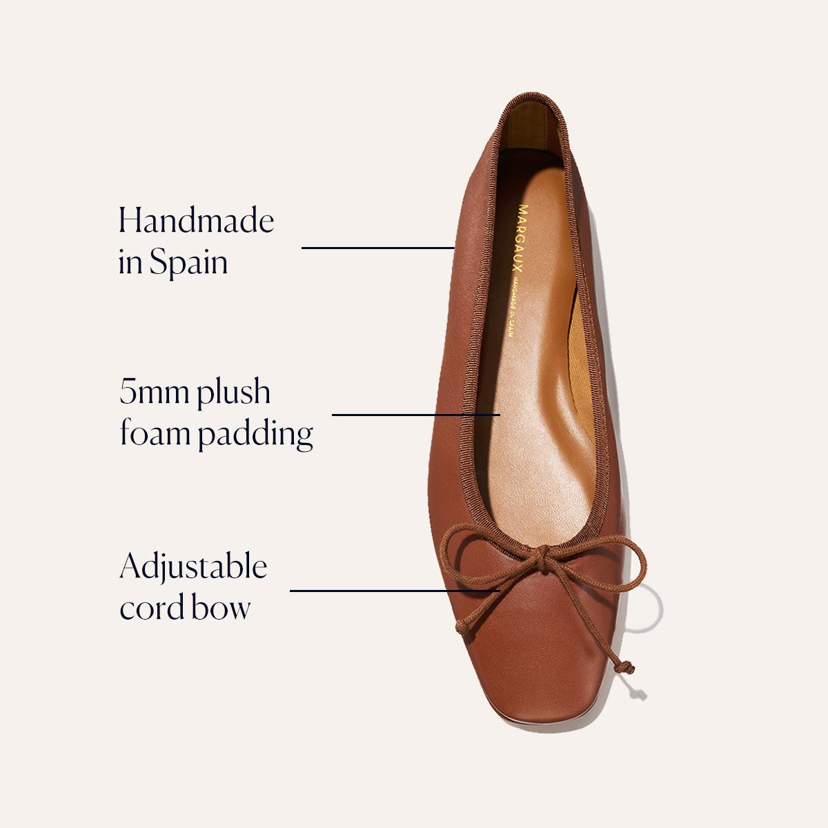 The Fonteyn - Cognac Nappa by Margaux is a comfort-first ballet flat, handcrafted in Spain with 5mm plush foam padding and an adjustable cord bow on the toe for a perfect fit.